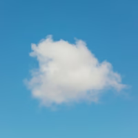 a single white cloud drifting in a blue sky